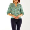 Woman in brushstroke plaid top