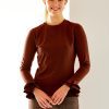 Woman in chocolate long sleeve top