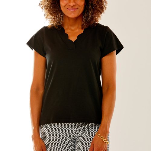 Woman in black scallop edge top