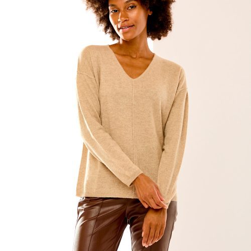 Woman in sand heather v neck sweater