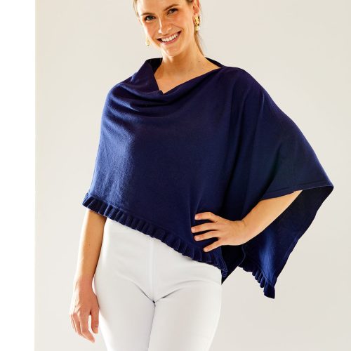 Woman in navy ruffle poncho