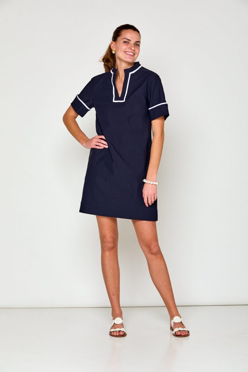 Woman in navy short sleeve dress