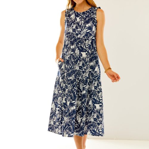 Woman in dress with white/navy leaves