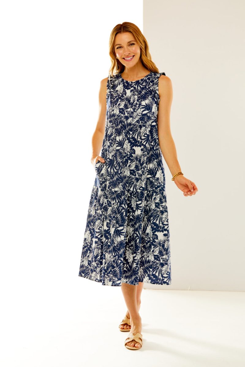 Woman in dress with white/navy leaves