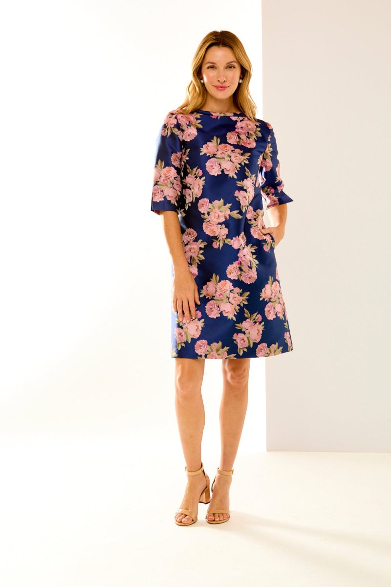 Woman in navy roses dress