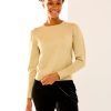 The lurex pullover in gold with button cuff