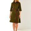 Woman in olive dress with faux leather sash