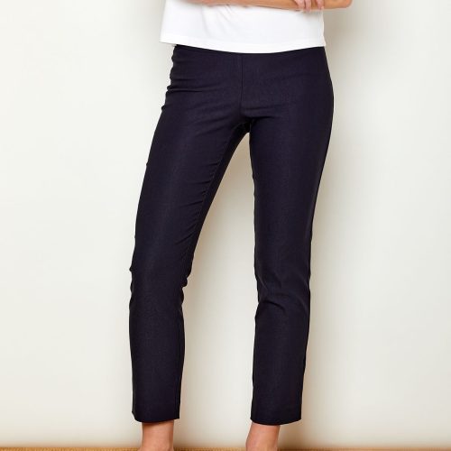 Woman in fitted navy colored pants