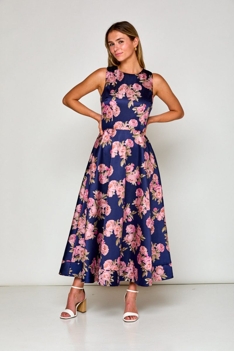 Woman in navy floral dress