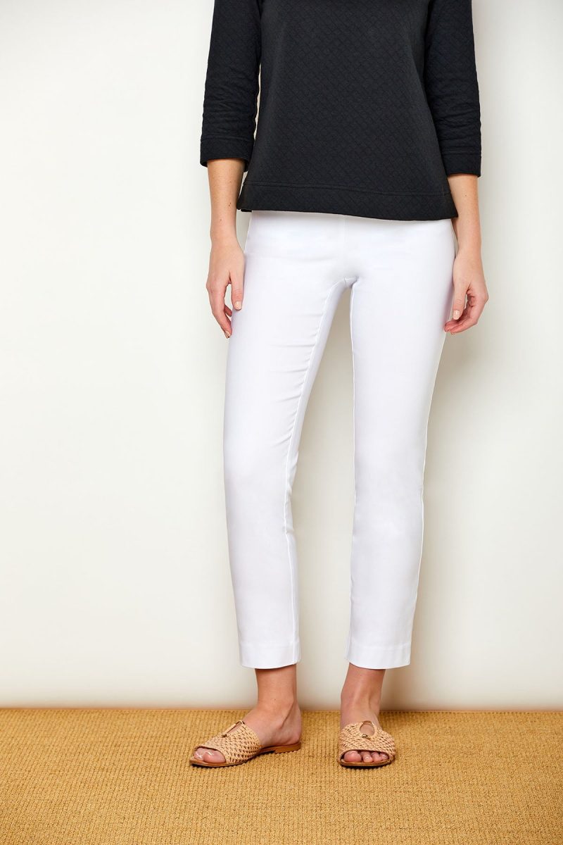 Woman in fitted white pants