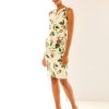 Woman in sun garden print dress