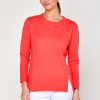 Woman in coral sweater