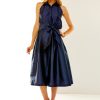 Woman in navy taffeta dress