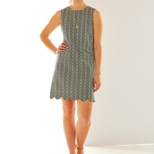 Woman in scalloped hem dress