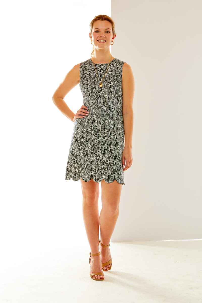 Woman in scalloped hem dress