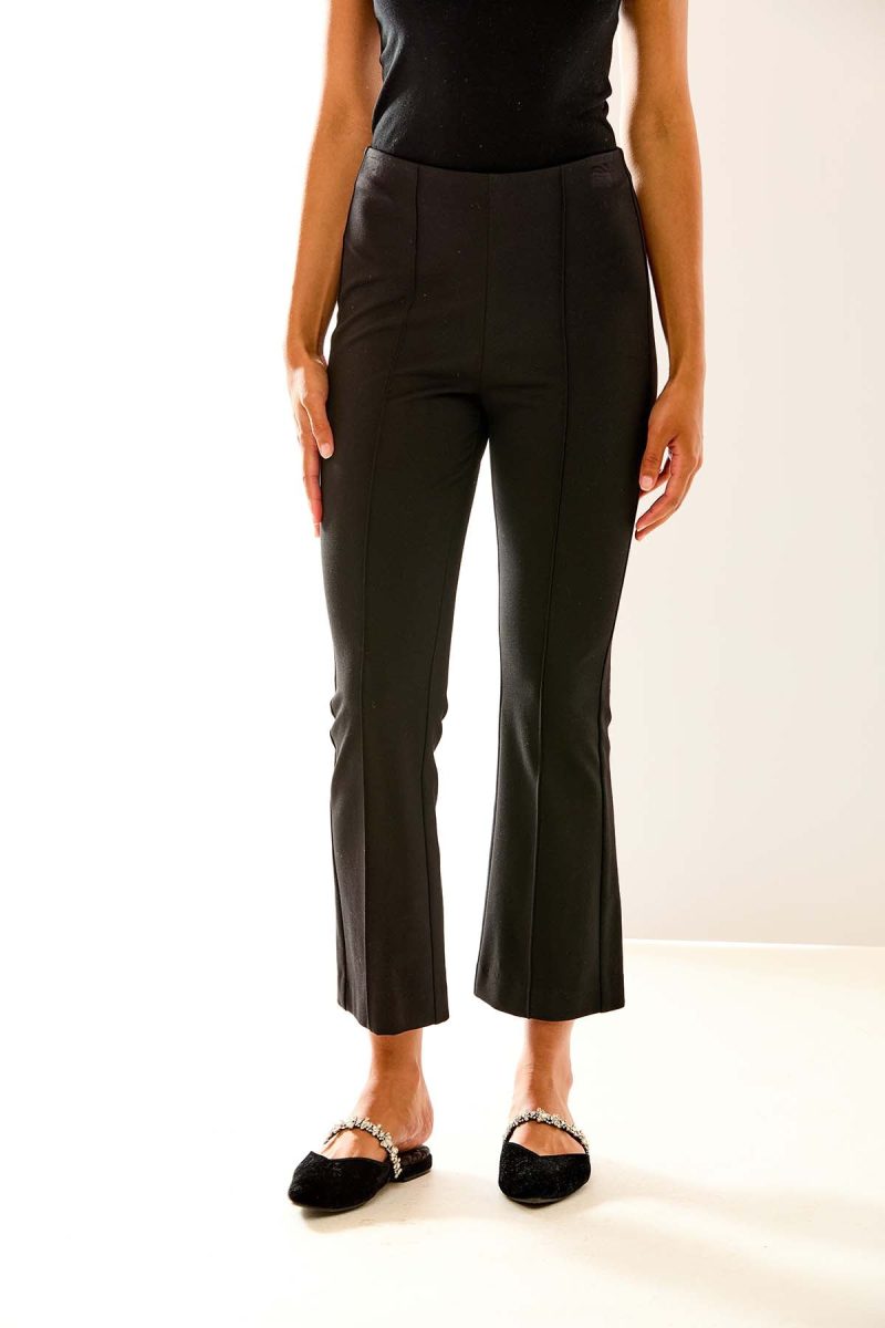 Woman in black ponte pant