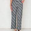 Woman in black and white print pants