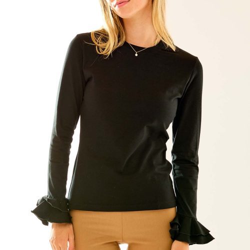 Woman in black long sleeve top