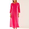 Woman in flamingo maxi linen dress