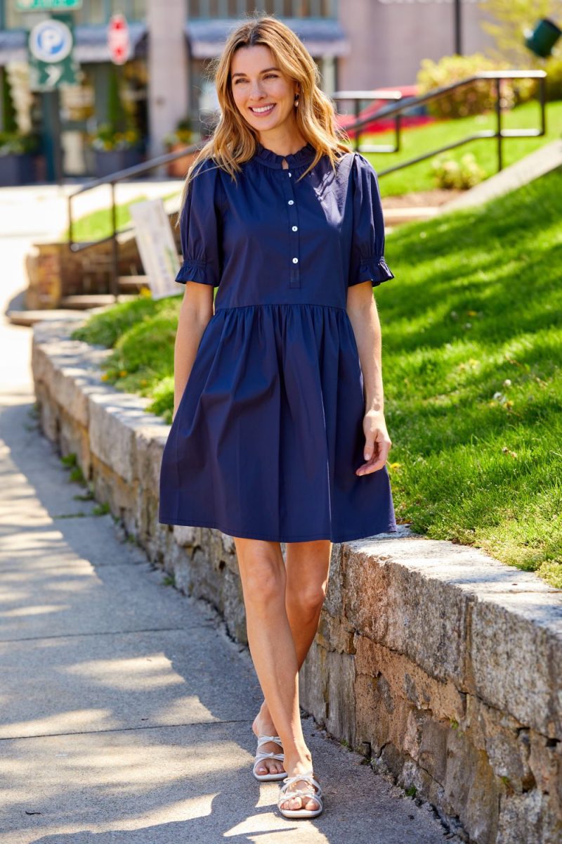 WOMAN IN NAVY DRESS