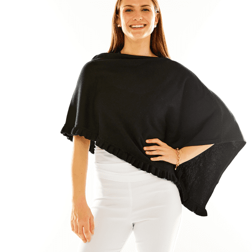 Woman in black ruffle poncho