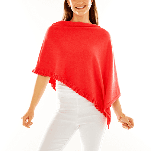 Woman in coral ruffle poncho