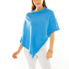 Woman in ocean blue ruffle poncho