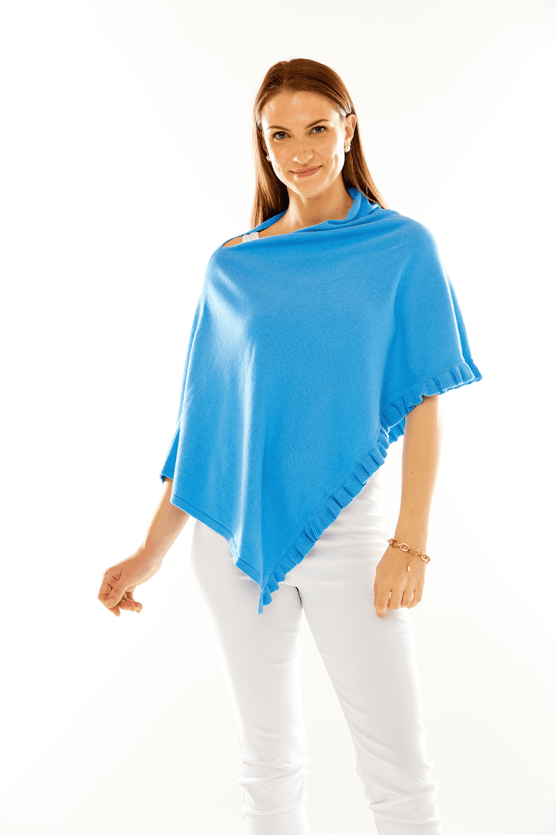 Woman in ocean blue ruffle poncho