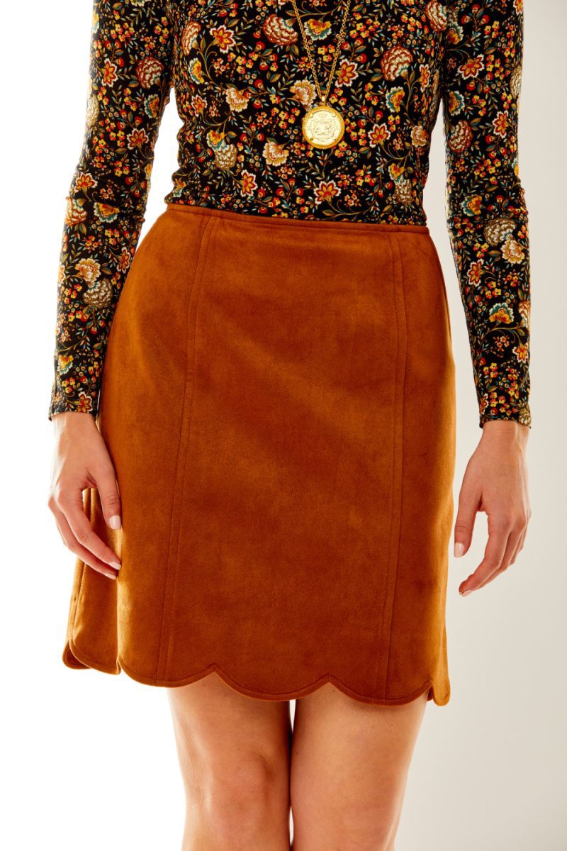 Woman in faux suede skirt