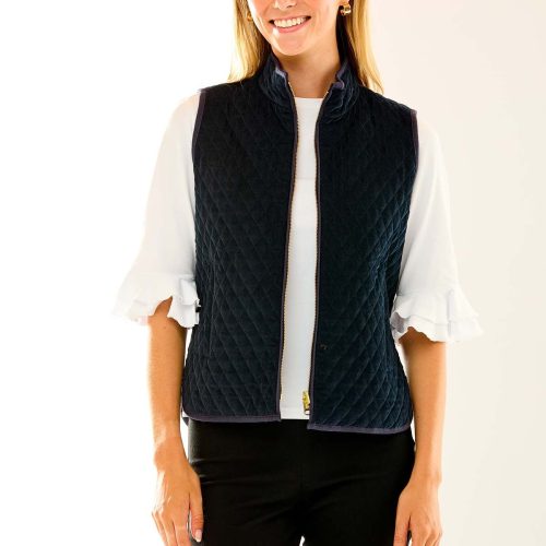 Woman in navy quilted vest