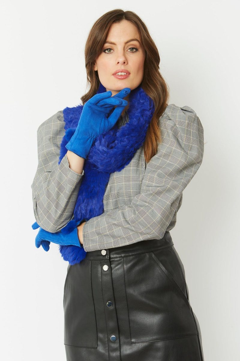 Woman in blue faux suede faux fur gloves