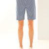 Woman in check slash pocket short