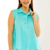 Woman in blue sleeveless linen top