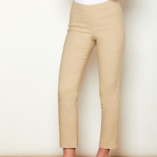 Woman in fitted sand colored pants