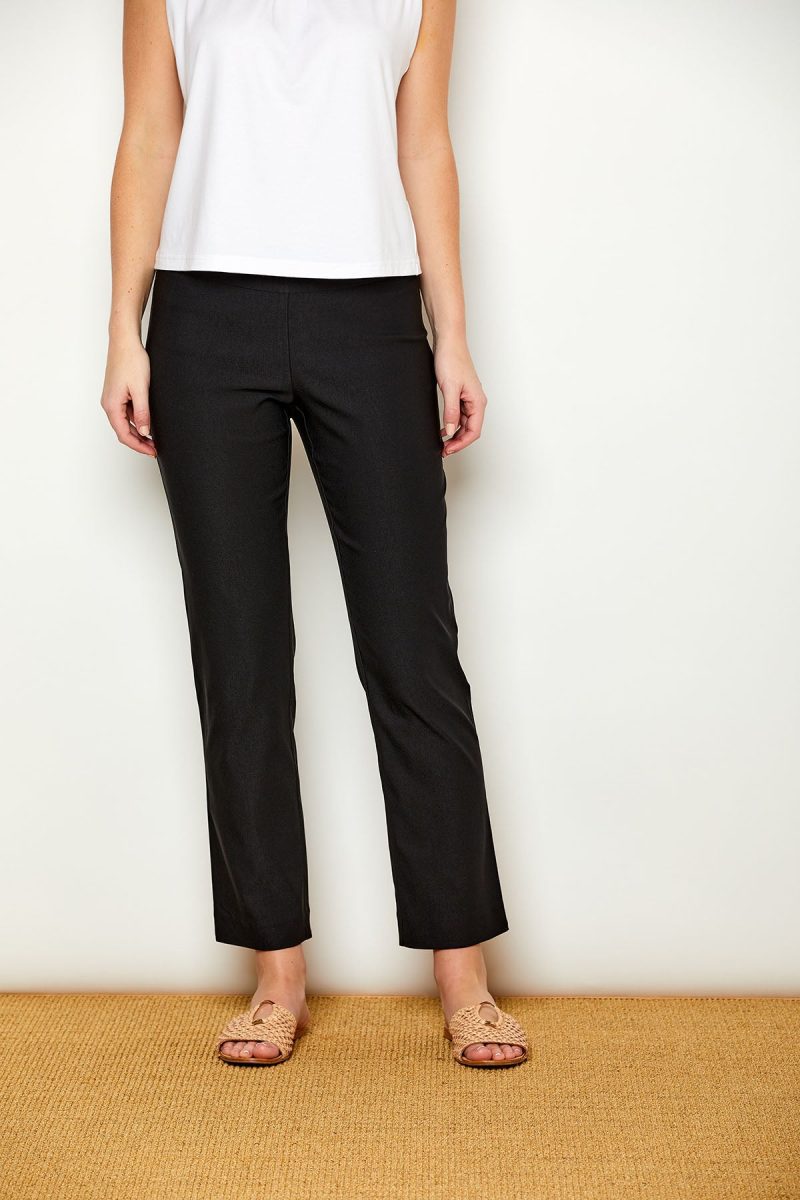 Woman in fitted black colored pants