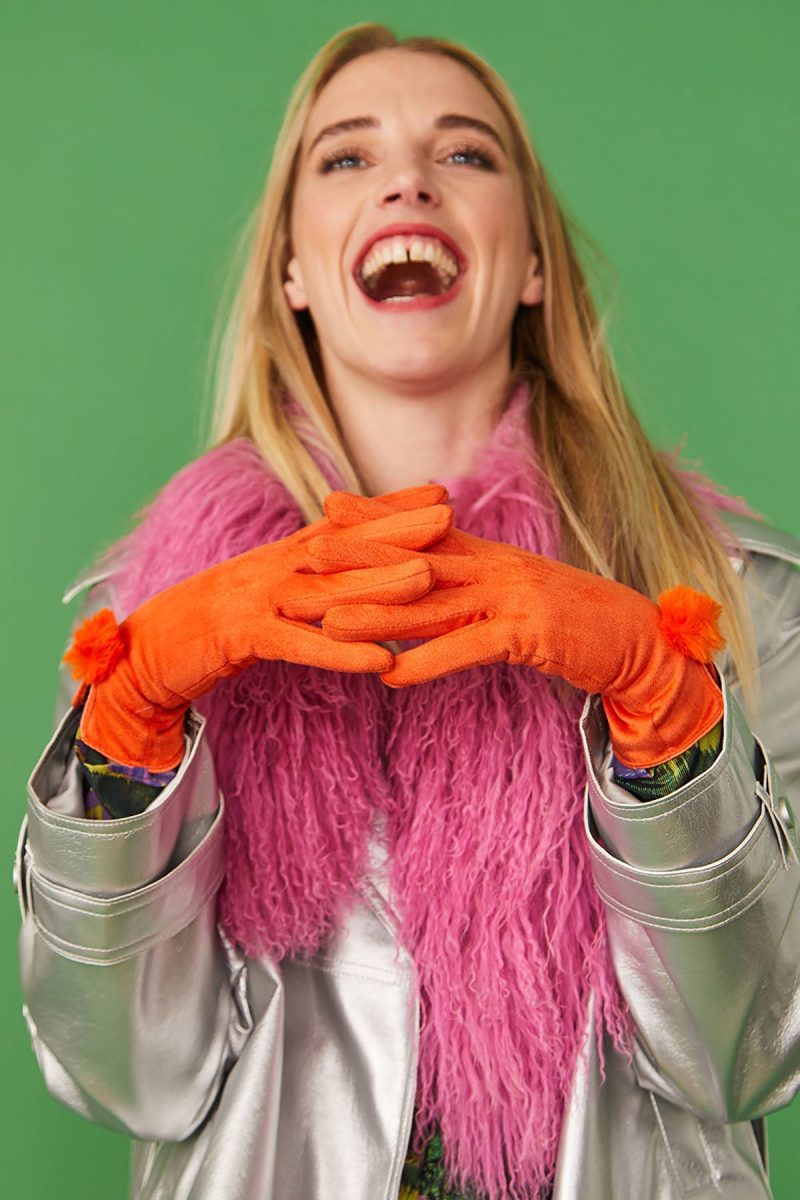 Woman in orange faux suede faux fur gloves