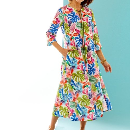 woman in multi-color palm leaf print caftan dress