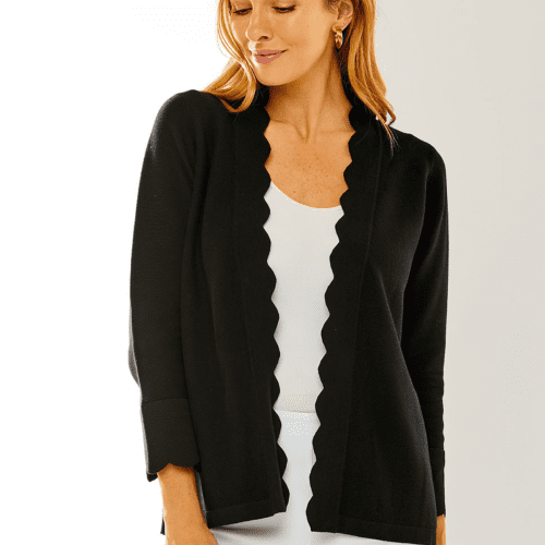 Woman in black scallop cardigan