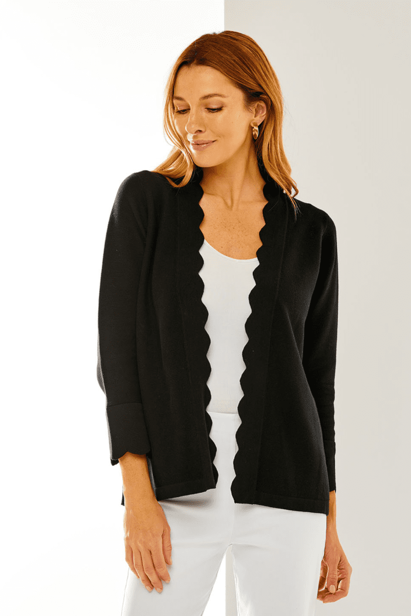 Woman in black scallop cardigan