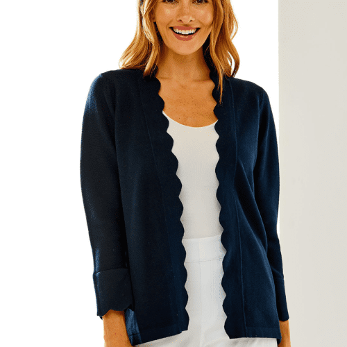 Woman in navy scallop cardigan