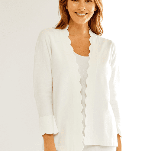 Woman in white scallop cardigan